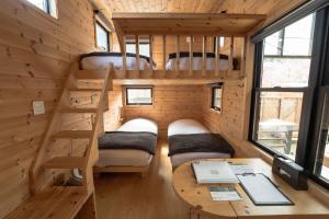 Letto o letti in una camera di Tiny Base The River HOUSE & TRAILER