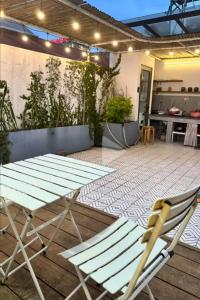 a picnic table and a chair on a patio at Pamela Homestay Cao Bằng in Cao Bằng +33 photos