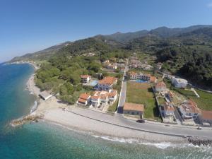 an aerial view of a beach with houses and the ocean at Hotel Apartment Agios Konstantinos in Ágios Konstantínos
