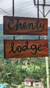a sign that reads trending knowledge hanging from a pole at CHENTI LODGE KELIMUTu in Kelimutu