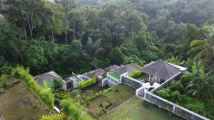 an aerial view of a house in the forest at Anggrek villa Ubud in Ubud