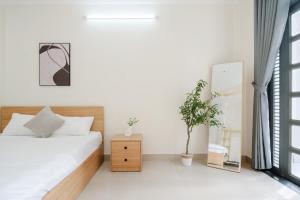 Postel nebo postele na pokoji v ubytování Elysian Home 2 - Centre District 1