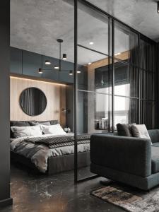 a bedroom with a bed and a couch at Kost Azkya 