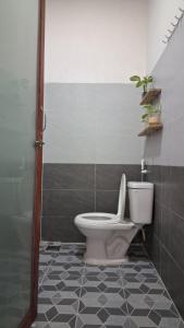 a bathroom with a toilet and a shower at đất phú homestay phú yên in Ða Ngủ (2) +71 photos