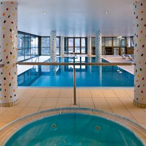 a swimming pool in the middle of a building at Hotel Panorama in Andorra la Vella