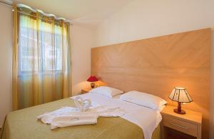 Кровать или кровати в номере Apartments Radević