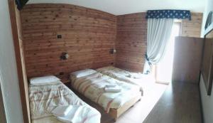 Postel nebo postele na pokoji v ubytování Rifugio Orso Bruno