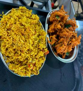 two bowls of food sitting on a table at Black Pepper Cottage Yercaud in Yercaud