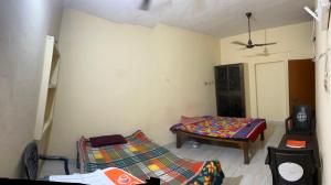 Ένα ή περισσότερα κρεβάτια σε δωμάτιο στο Jaykishan sadan