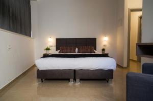 Letto o letti in una camera di Johnny Hotel