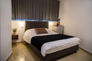 Letto o letti in una camera di Johnny Hotel