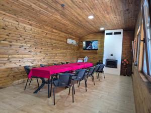 a conference room with a long table and chairs at Вили Янкови in Dobri Dyal