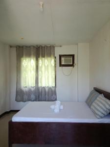 Katil atau katil-katil dalam bilik di Wjv Inn Hangar