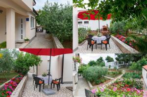 a table and chairs in a garden with flowers at Apartments Hortensia in Pula