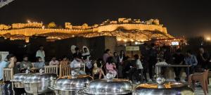 a group of people standing in front of a castle at Hotel Tofu safari in Jaisalmer