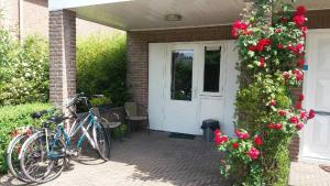 a house with two bikes parked in front of a door at Eindhoven4you in Eindhoven