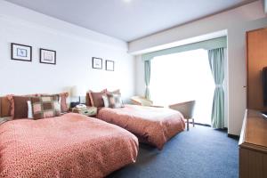 Postel nebo postele na pokoji v ubytování Hotel Villa Kuretake + 37 fotografií