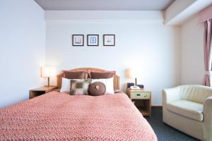 Postel nebo postele na pokoji v ubytování Hotel Villa Kuretake