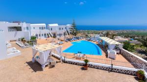 an aerial view of a resort with a swimming pool at Dream Island Hotel in Fira