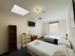 Postel nebo postele na pokoji v ubytování 360K - Central Comfy Great Value - City