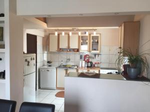 a kitchen with white appliances and a counter top at Apartments Vila Andja in Sveti Stefan