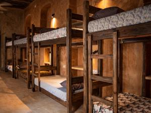 a group of bunk beds in a room at Firefly boutique Hotel Zanzibar in Zanzibar City +121 photos