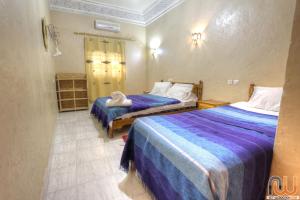 Postel nebo postele na pokoji v ubytování Kasbah Restaurant Amazir