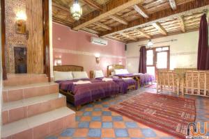 Postel nebo postele na pokoji v ubytování Kasbah Restaurant Amazir