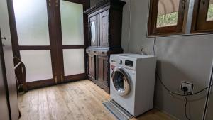 a laundry room with a washing machine in it at Harmony Hideaway Villa-Seeduwa in Seeduwa