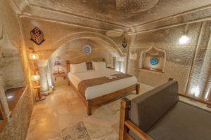 A bed or beds in a room at Zara Cave Hotel