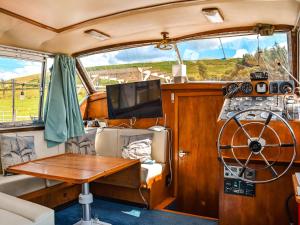 a view of the inside of a boat with a table at The Rose in Rhondda