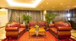 a waiting room with leather couches and a table at Argyle International Airport Hotel Shanghai in Shanghai