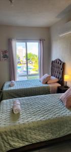 Ένα ή περισσότερα κρεβάτια σε δωμάτιο στο Casa Oasis Veracruzano
