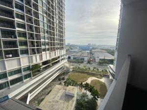 a view from the balcony of a tall building at LF Homestay I-city Studio, Shah Alam in Shah Alam