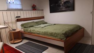 Ένα ή περισσότερα κρεβάτια σε δωμάτιο στο Gästezimmer Jülich mit Küche