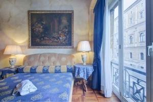 Posteľ alebo postele v izbe v ubytovaní Parione Suite Piazza Navona