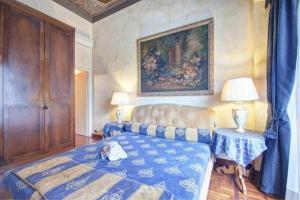 Posteľ alebo postele v izbe v ubytovaní Parione Suite Piazza Navona