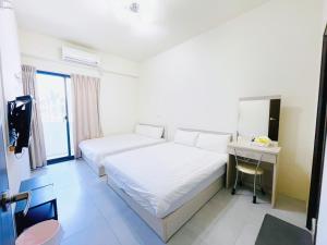 Letto o letti in una camera di Penghu Happy House