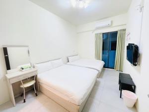 Letto o letti in una camera di Penghu Happy House