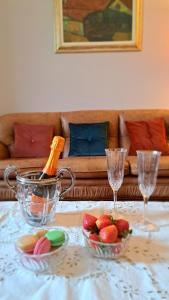 a table topped with bowls of fruit and wine glasses at CAVOUR257 in La Spezia