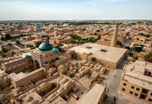an aerial view of a city with a mosque at Sarzamin Guest House in Khiva