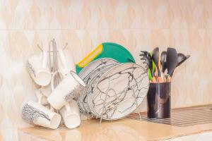 a shelf with a bunch of kitchen utensils on it at Blissful homes in Ruiru