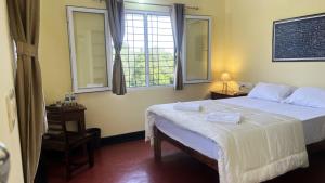 Postel nebo postele na pokoji v ubytování Surya Villa Guesthouse + 28 fotografií