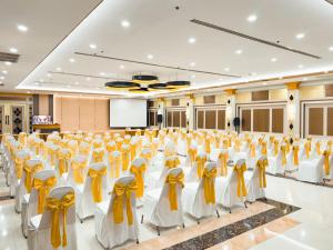 a conference room with chairs and a projection screen at Golden Empire Suvarnabhumi Hotel in Bang Kew Yai +28 photos