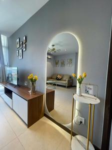 a living room with an archway in the middle of a room at Condotel CSJ Vũng Tàu - Apartment Luxury CSJ Vung Tau in Vung Tau