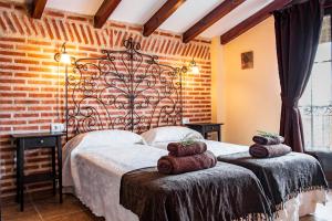 En eller flere senge i et værelse på El Corral De La Antigua