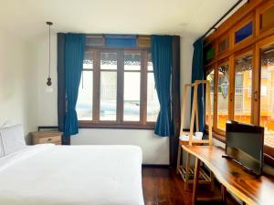 Ein Bett oder Betten in einem Zimmer der Unterkunft Pao Come Boutique House