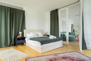 a bedroom with a bed and a large window at Breathtaking Panorama view 3Br Balcony in Budapest