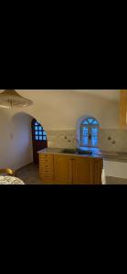 a kitchen with a counter and a sink and a window at Mimi's House 1 in Chios +52 photos