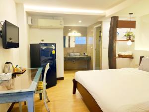Ein Bett oder Betten in einem Zimmer der Unterkunft Pao Come Boutique House
